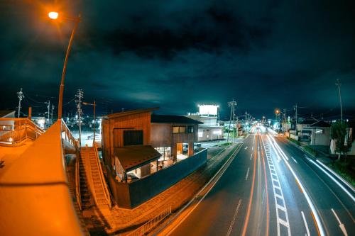 a building on the side of a street at night at GOAT BASE 仲間と楽しく過ごせる貸切宿 stay in Nagano