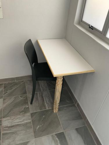 a desk and a chair in a room at Riverside Recreation Lodge in Katima Mulilo