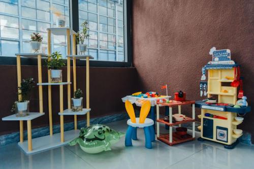 a toy room with a toy turtle and shelves at 云硕客栈 in Shangri-La