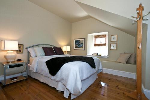 a bedroom with a large bed and a window at Clyde Hall Bed and Breakfast in Lanark