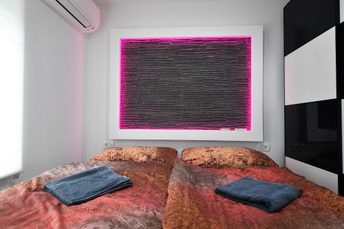 a bedroom with two beds and a pink window at CASA BOX PREMIUM free garage in Maribor