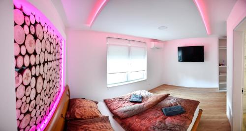 a bedroom with two beds and a window at CASA BOX PREMIUM free garage in Maribor