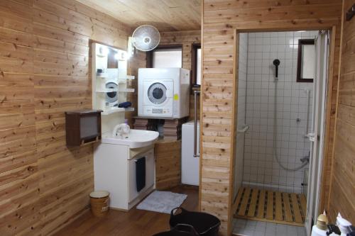 a bathroom with a toilet and a sink and a shower at Hotel Relation in 門司港 in Kitakyushu