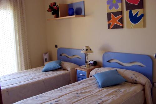 Кровать или кровати в номере Beachfront penthouse in Residencial Dos Mares