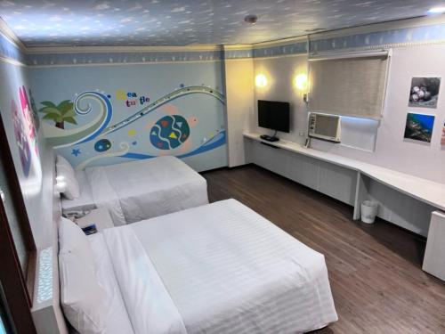 Μια τηλεόραση ή/και κέντρο ψυχαγωγίας στο Tapeng Bay Holiday Hotel