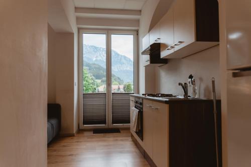 a kitchen with a view of a mountain at Kalkalpen Apartments in Spital am Pyhrn