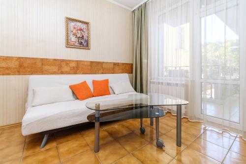 a living room with a couch and a glass table at Noviz Hotel in Plovdiv