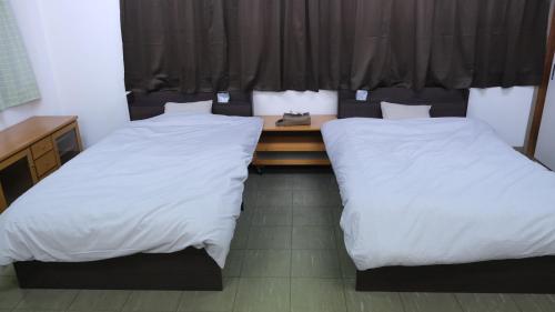Postel nebo postele na pokoji v ubytování wanderers Inn