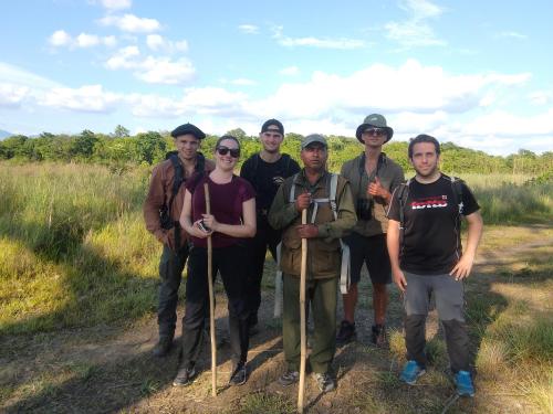 a group of people posing for a picture on a trail at Jungle Base Camp in Bardia