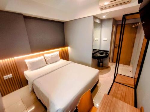 Voodi või voodid majutusasutuse Studio One Thamrin Hotel toas