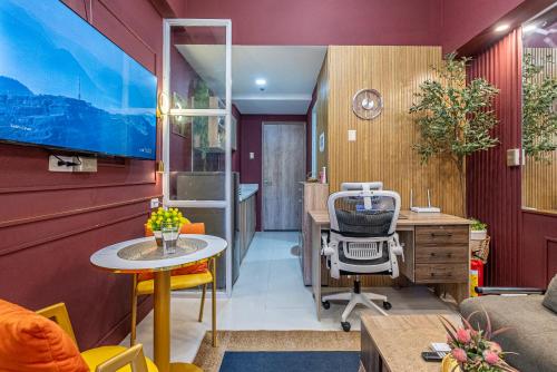 an office with a desk and a chair in a room at Primeworld District Condo - Near Mactan Airport in Lapu Lapu City