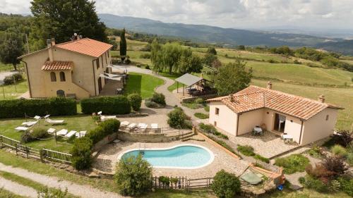 an aerial view of a house with a swimming pool at Le Casaline by VacaVilla in Tepolini