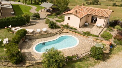 an aerial view of a house and a swimming pool at Le Casaline by VacaVilla in Tepolini