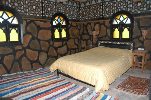 Ein Bett oder Betten in einem Zimmer der Unterkunft Rose du Sable