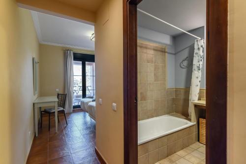 a bathroom with a bath tub and a sink at El Rincon del Golf II PLUS by Ĥ - Isla Canela Golf GRHII27P30 in Isla Canela