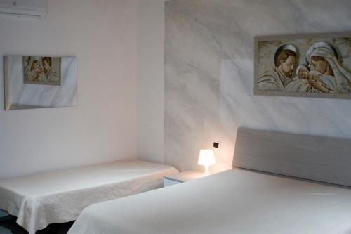 Кровать или кровати в номере Casa vacanze Martinclà