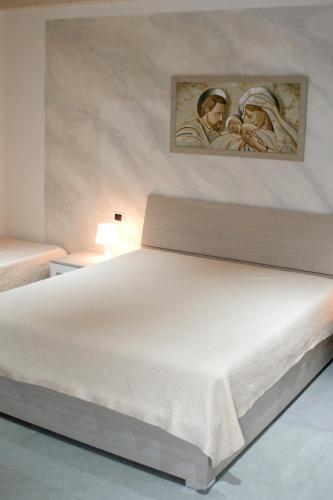 Кровать или кровати в номере Casa vacanze Martinclà