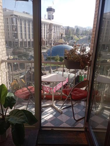 a view of a balcony with a table and chairs at Булгакоff- укриття поряд, 20 метрів in Kyiv