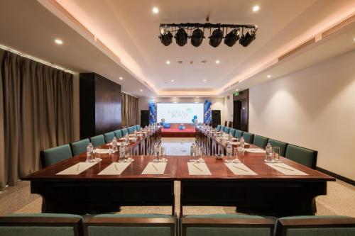 a large conference room with a long table and chairs at Green Beach Hotel Nha Trang in Nha Trang