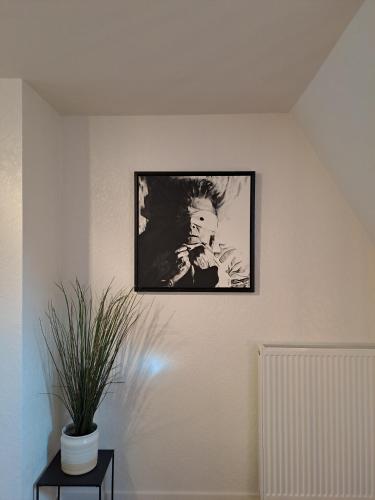 a black and white photo of a man on a wall at The Carmelite in Ypres