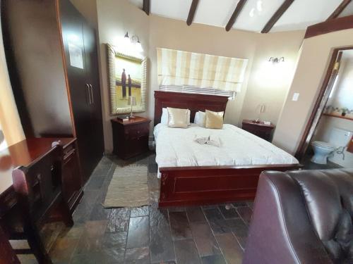 Ένα ή περισσότερα κρεβάτια σε δωμάτιο στο Gaggle Inn Guest Lodge