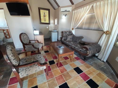 Χώρος καθιστικού στο Gaggle Inn Guest Lodge