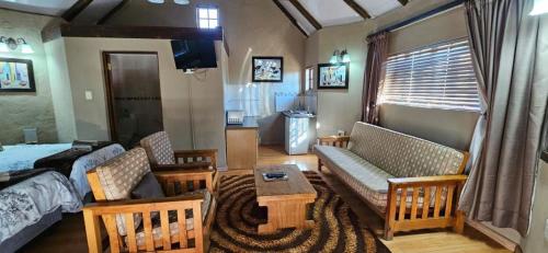 Χώρος καθιστικού στο Gaggle Inn Guest Lodge