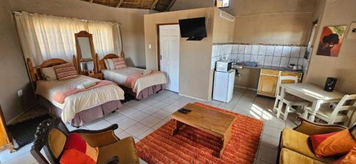Ένα ή περισσότερα κρεβάτια σε δωμάτιο στο Gaggle Inn Guest Lodge