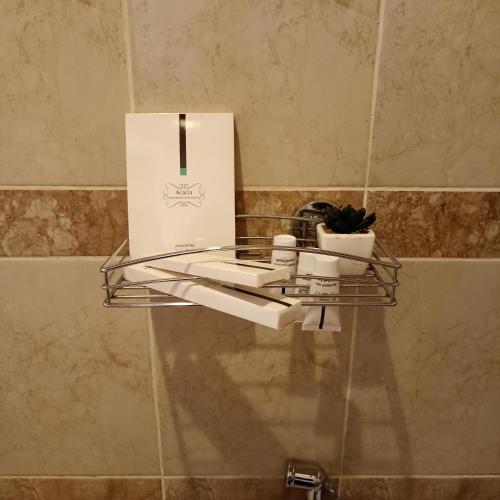 a shelf with a box on top of a wall at رغيد للشقق الفندقية حائل - طريق جرير in Hail