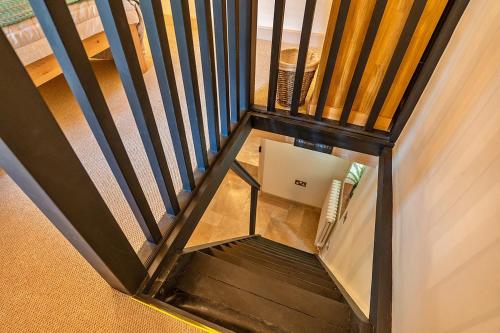 an overhead view of a stairs with a box at Finest Retreats - The Thatch at Winterborne Houghton in Winterborne Stickland