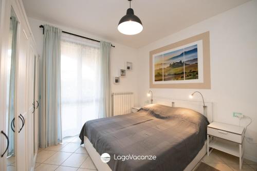 Ένα ή περισσότερα κρεβάτια σε δωμάτιο στο Villaggio Tavaredo - Appartamento 02