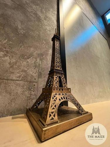 a model of the eiffel tower on a table at The Urban Lodge - Tasek Avenue Ipoh in Ipoh