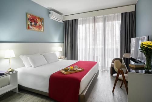 Postel nebo postele na pokoji v ubytování Hotel Estacão - Braga