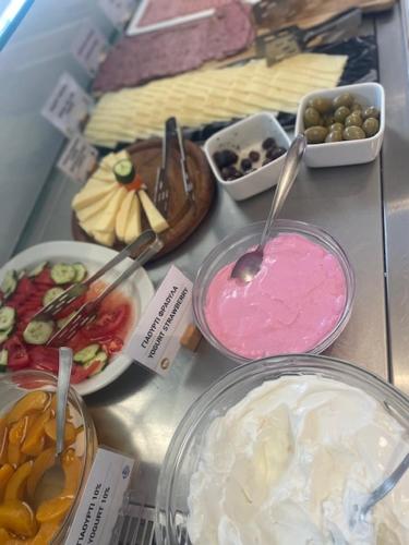 a bunch of different types of food on a table at Meliton Inn Hotel & Suites by the beach in Neos Marmaras