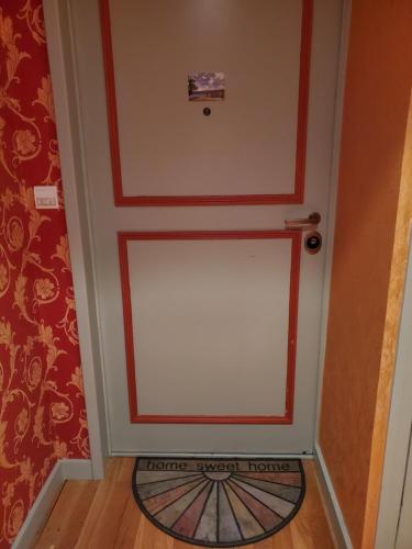 a door to a room with a door mat at Lac Saint-Point au balcon in Malbuisson