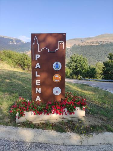 a sign for a hotel on the side of a road at A casa di zia Maly in Palena