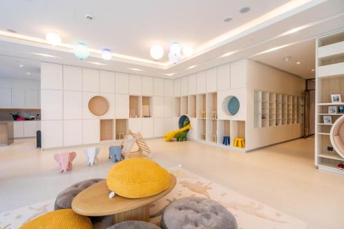 a large room with a yellow hat on a table at GuestReady - Elegant 1BR l Premium Amenities in Dubai