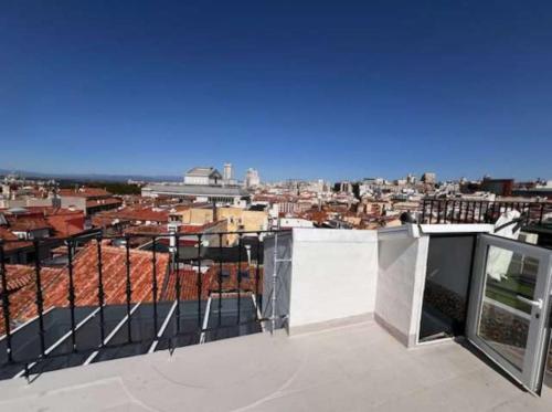 a view of a city from the roof of a building at Alhambra Suites in Madrid