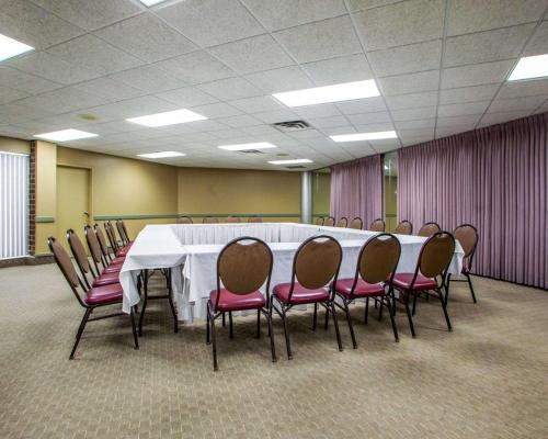 a conference room with a white table and chairs at Quality Inn & Suites Orland Park - Chicago in Orland Park