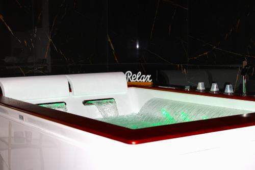 a booth at a show with a table with at InCentro Elegant Rooms in Messina