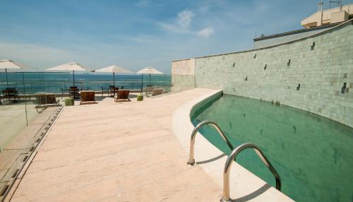 a swimming pool on the side of a building at Arena Leme Hotel in Rio de Janeiro