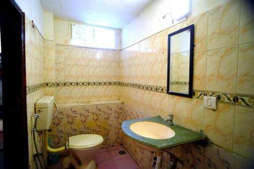 Koupelna v ubytování RAAJNEST SERVICE APARTMENTS