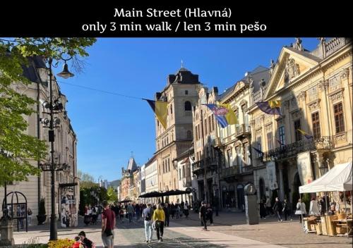 a city street with people walking down the street at E1 Luxury OldTown Apt - 2x Parking, Foodstore, PCscreen, Netflix, Unlimited Music, Crib, BabyChair, FastWifi, Aircon in Košice
