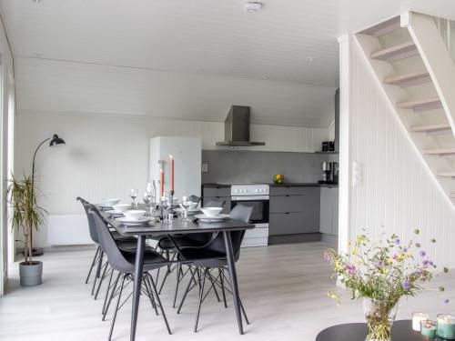 a kitchen and dining room with a table and chairs at Holiday Home Brosme by Interhome in Bømlo
