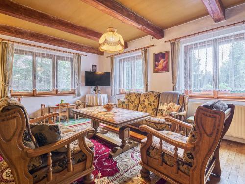 a living room with a table and chairs at Holiday Home Horní Lánov by Interhome in Horní Lánov