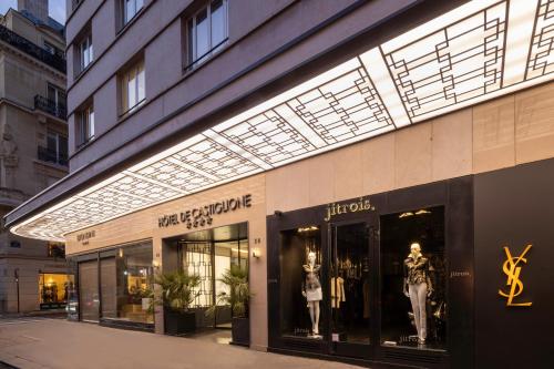 a store front with a lighted sign on it at Hôtel De Castiglione in Paris