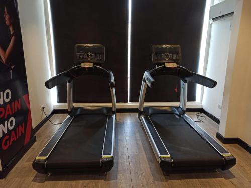 two elliptical machines in a gym with at Red Sea Hotel in Būr Tawfīq