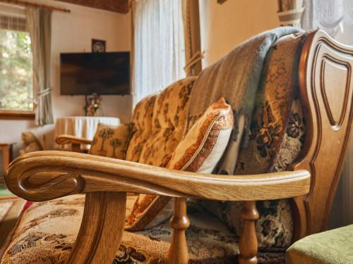 a couch with a blanket on it in a living room at Holiday Home Horní Lánov by Interhome in Horní Lánov