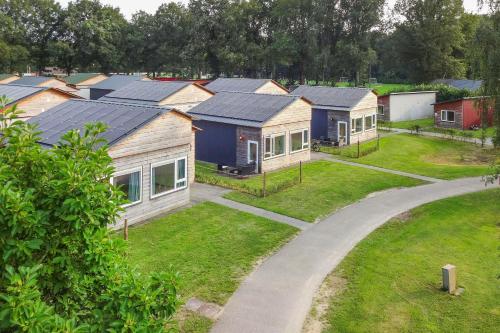a row of homes with solar panels on their roofs at Landgoed Leudal in Haelen