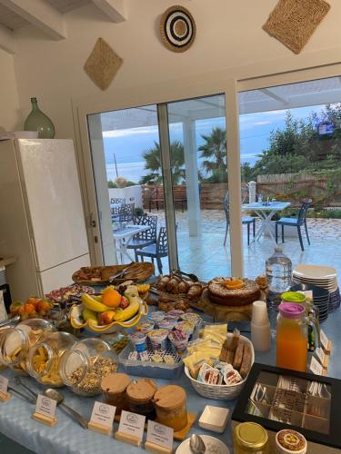 a table with a buffet of food on it at B&B Sicilia in Versi in Custonaci